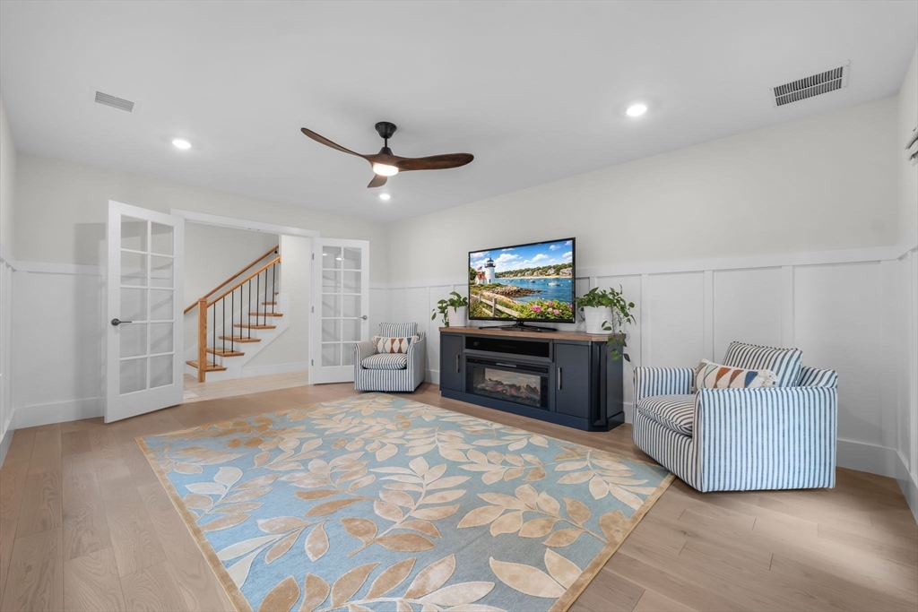 28 Oxbow Road, Unit 142 Raynham, MA 02767 - Photo 34 of 42 a living room with furniture and a flat screen tv