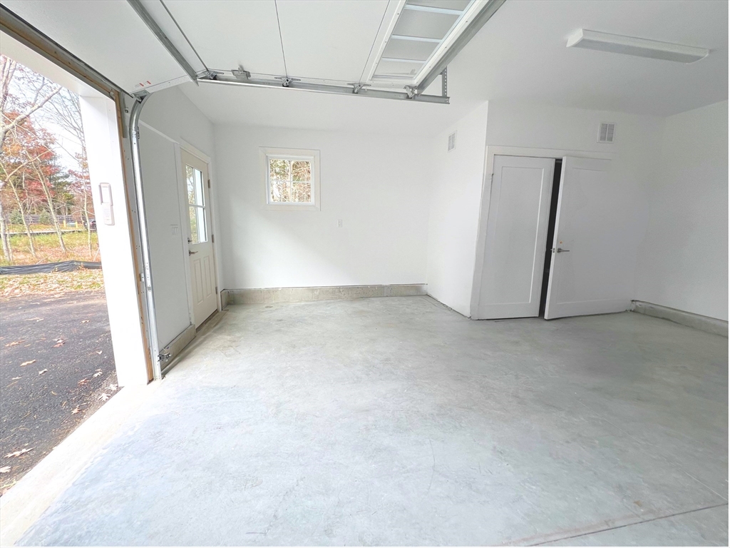 28 Oxbow Road, Unit 142 Raynham, MA 02767 - Photo 37 of 42 an empty room with windows