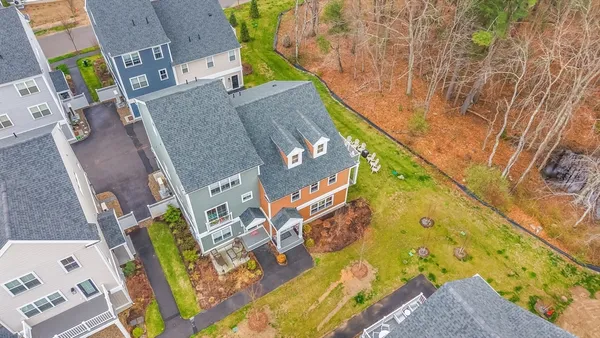 aerial view of a house with a yard