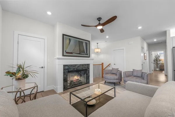 a living room with furniture and a fireplace