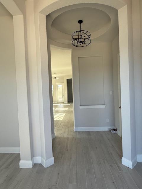 1432 Ridge Runner Drive Georgetown, TX 78628 - Photo 5 of 27 Entry with vestibule in corridor to garage and kitchen. Light wood-style flooring and arched walkways