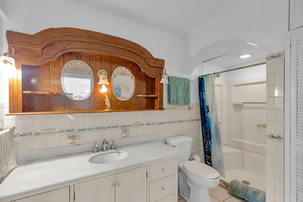 a view of a dining room with furniture large windows and wooden floor