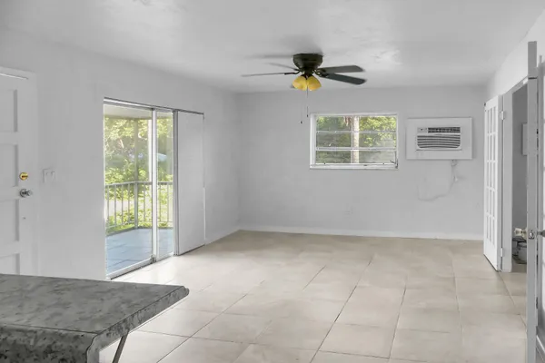 a kitchen with granite countertop a sink and cabinets