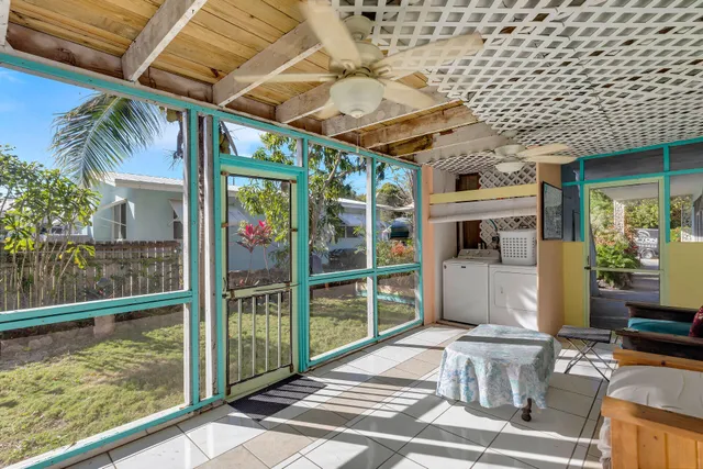 a kitchen with cabinets appliances a sink and a stove