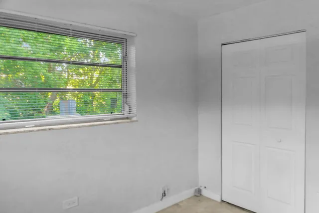 a white cabinets and window