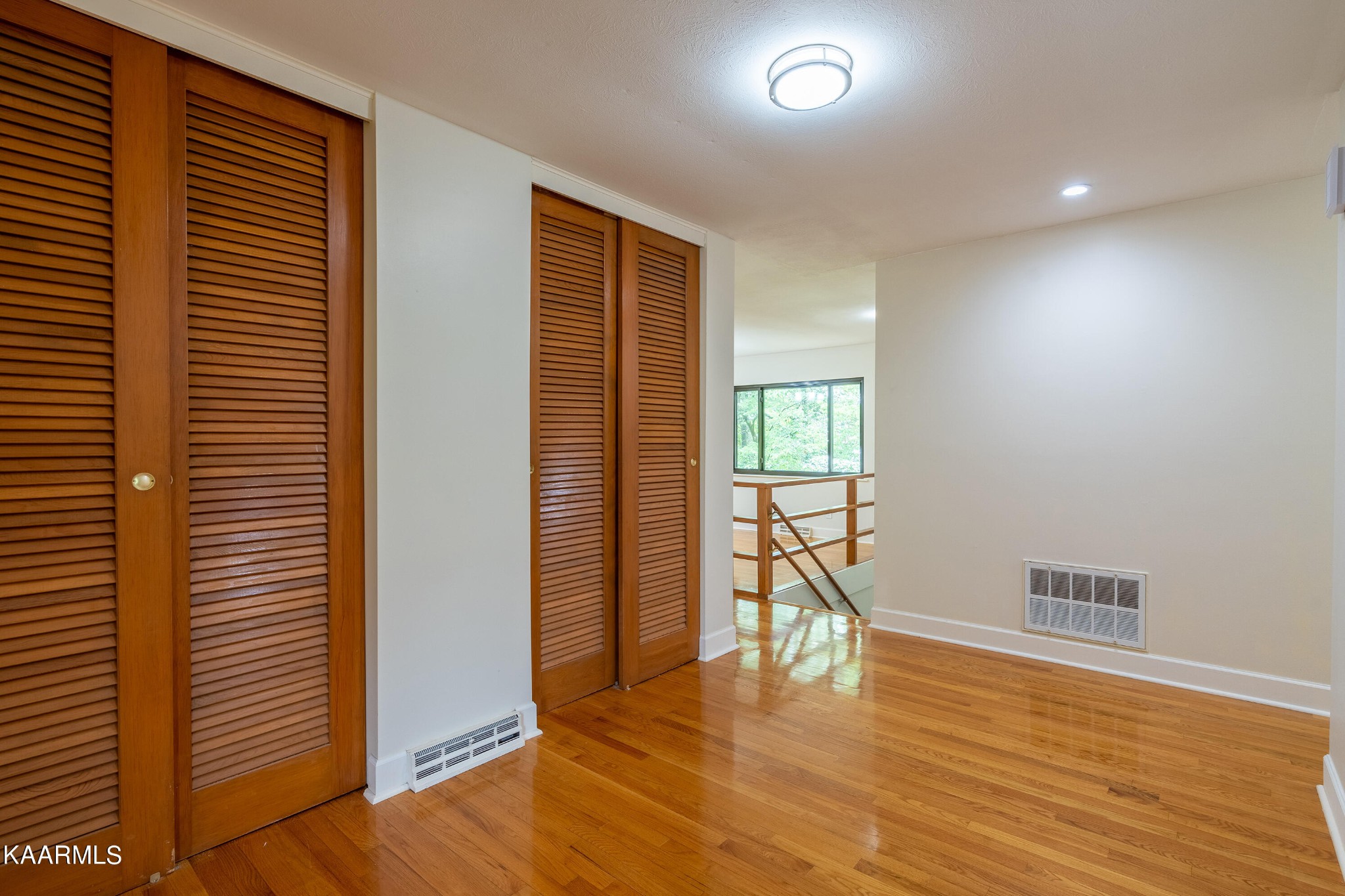 103 Canterbury Road Oak Ridge, TN 37830 - Photo 6 of 27 a view of empty room with wooden floor and fan