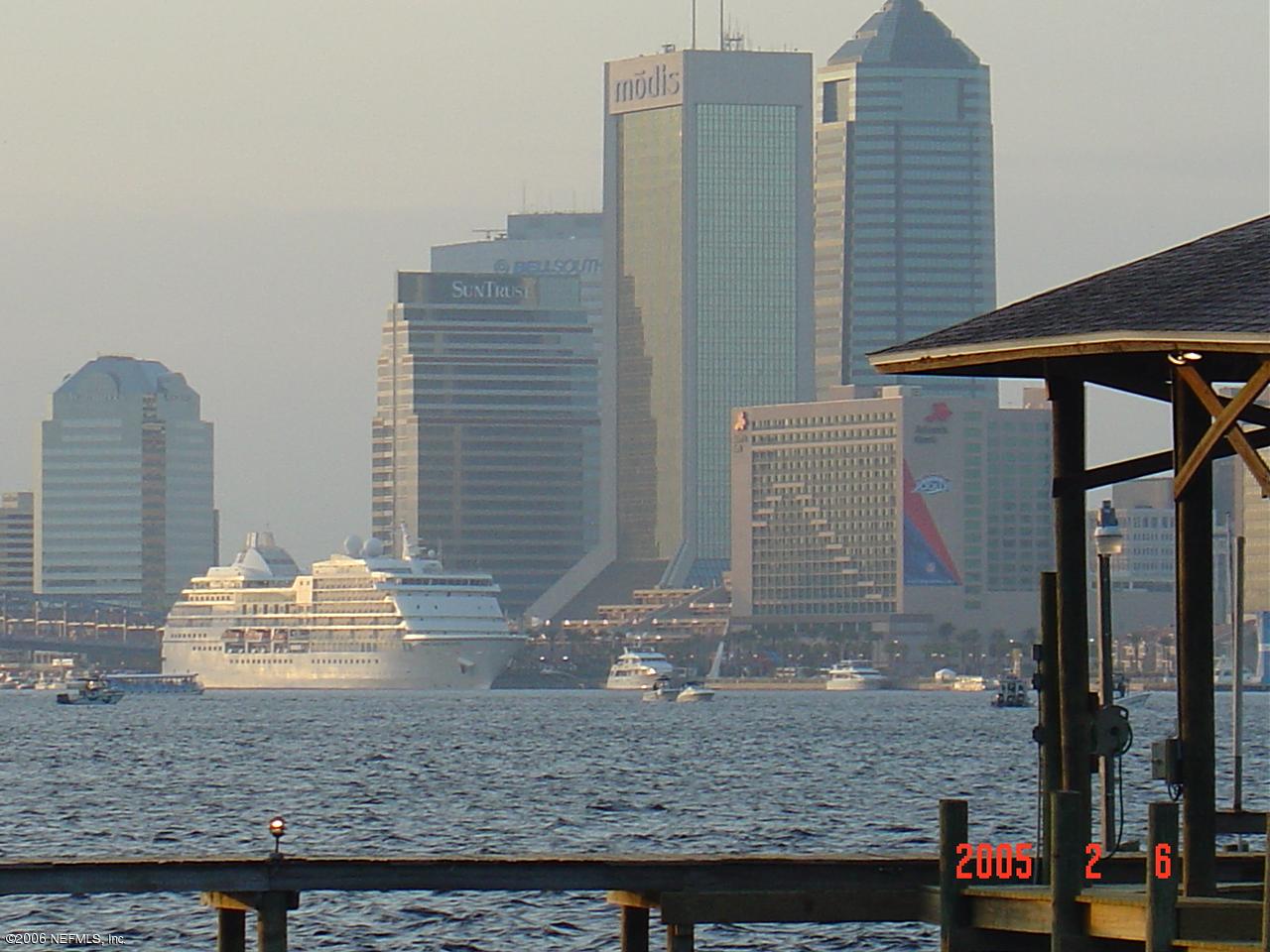 1016 Holmesdale Road Jacksonville, FL 32207 - Photo 2 of 4 a bathroom with a granite countertop sink and a mirror