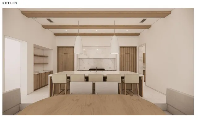 a kitchen with stainless steel appliances a stove and white cabinets