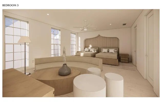 a living room with furniture a flat screen tv and a large window