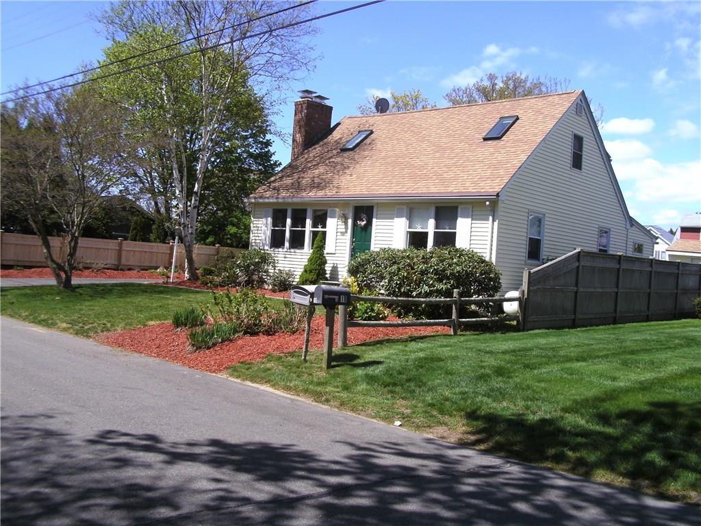 15 Seacrest Road Old Saybrook, CT 06475 - Photo 1 of 1 a front view of house with yard and green space