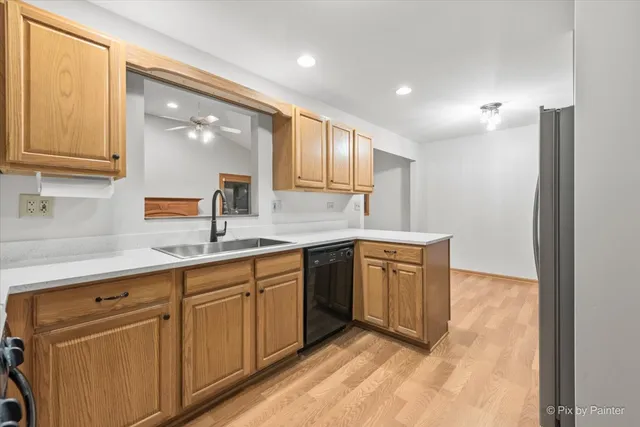 a kitchen with granite countertop white cabinets and white appliances