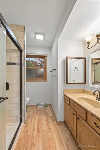 a spacious bathroom with a sink and a mirror