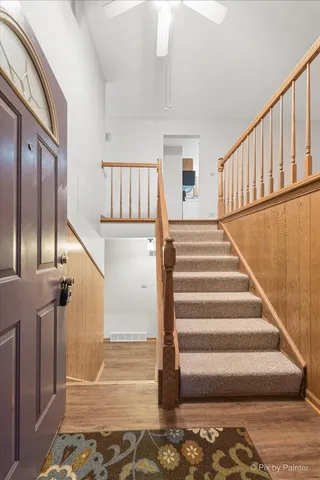 a view of entryway with wooden floor