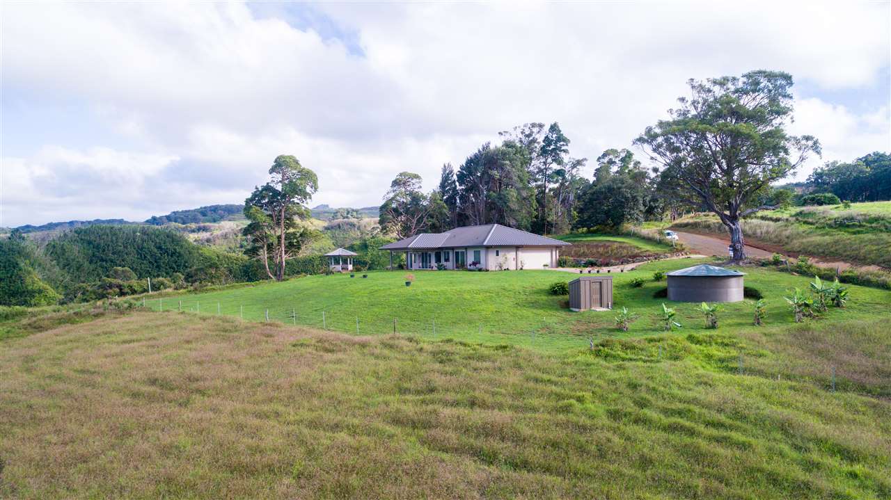 397 B Burns Road Haiku, HI 96708 - Photo 8 of 8 a view of a house with a yard and sitting area