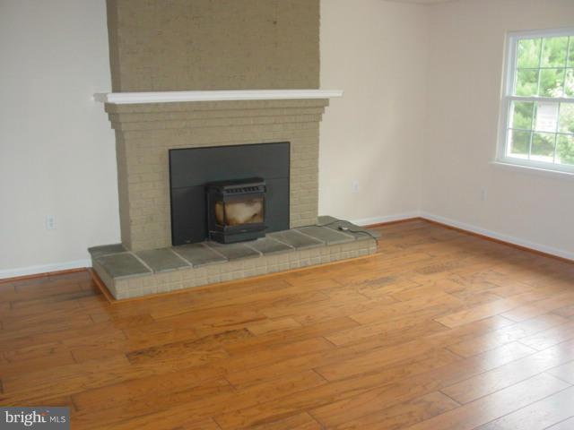 17914 Marshall Mill Road Hampstead, MD 21074 - Photo 3 of 17 an empty room with a fireplace