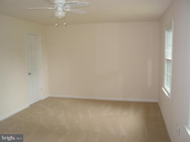 17914 Marshall Mill Road Hampstead, MD 21074 - Photo 8 of 17 en empty room with a fan