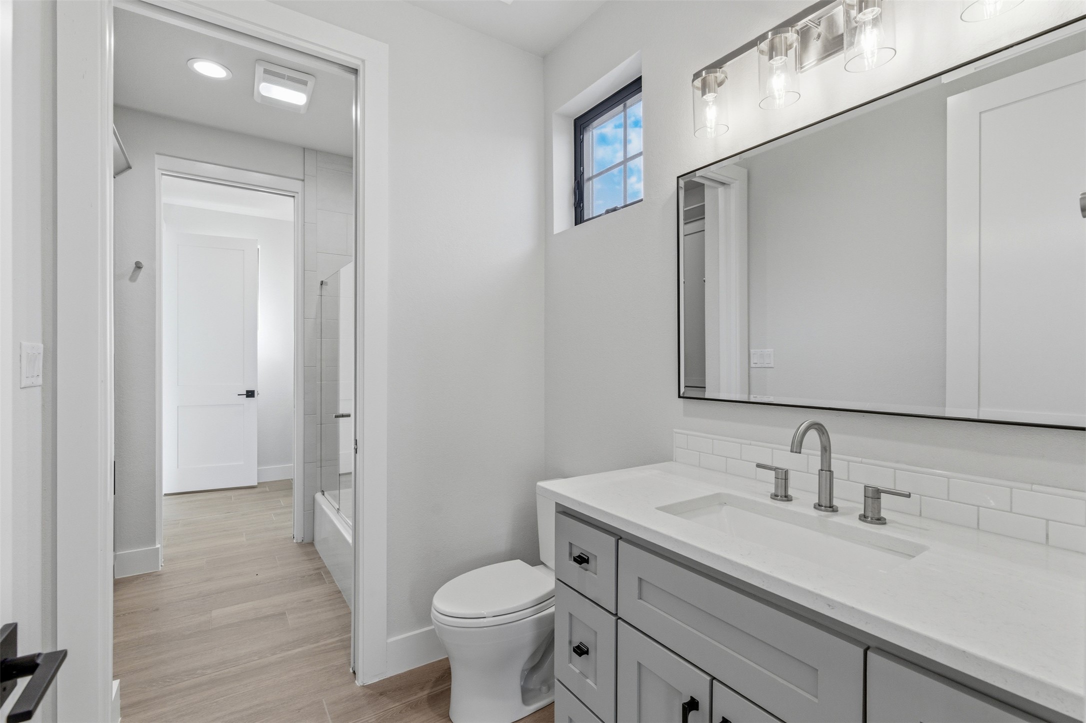 27619 Sunset Loop Garden Ridge, TX 78266 - Photo 20 of 39 Sleek modern finishes and clean lines define this contemporary washroom space.