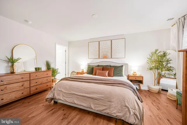 a bedroom with a bed and a dresser