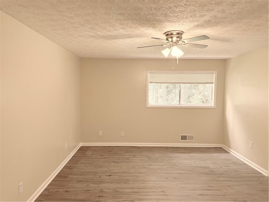 4707 Riverwood Circle Decatur, GA 30035 - Photo 13 of 17 wooden floor in an empty room