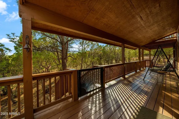 a view of balcony with wooden floor