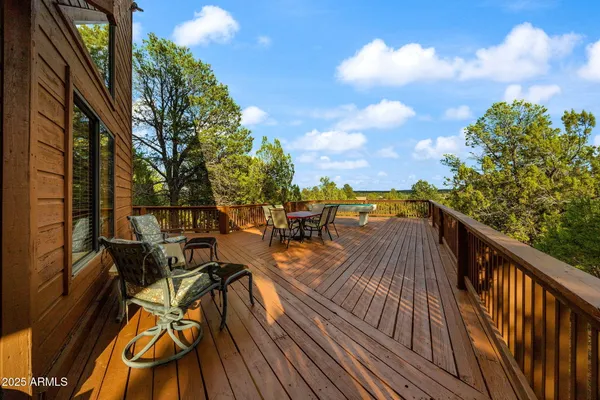 a view of house with outdoor space and sitting area