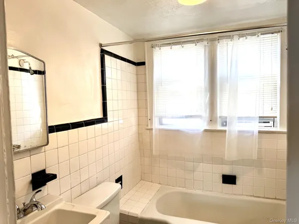 view of an empty room with a window