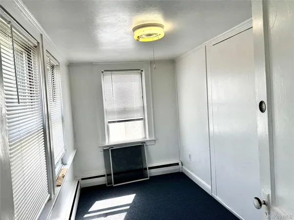 a view of a small space with wooden floor