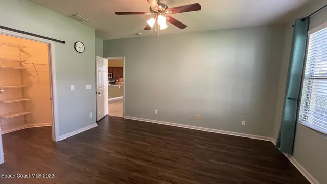 a bathroom with a double vanity sink toilet and shower