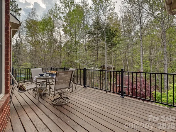 a view of a chairs on wooden deck