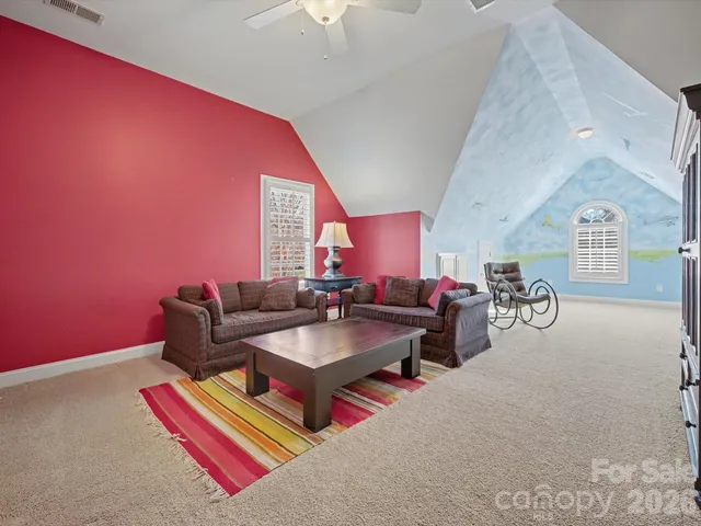 a living room with furniture and a rug