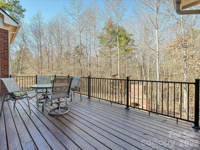 a wooden bench sitting in the middle of a yard