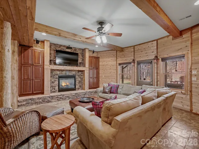a kitchen that has a lot of cabinets in it and stainless steel appliances