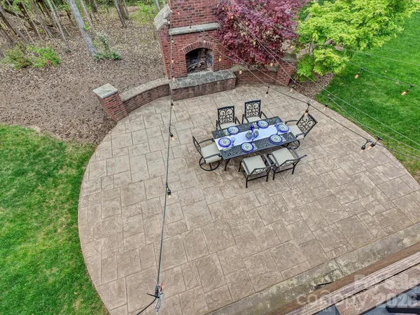a view of a backyard with sitting area