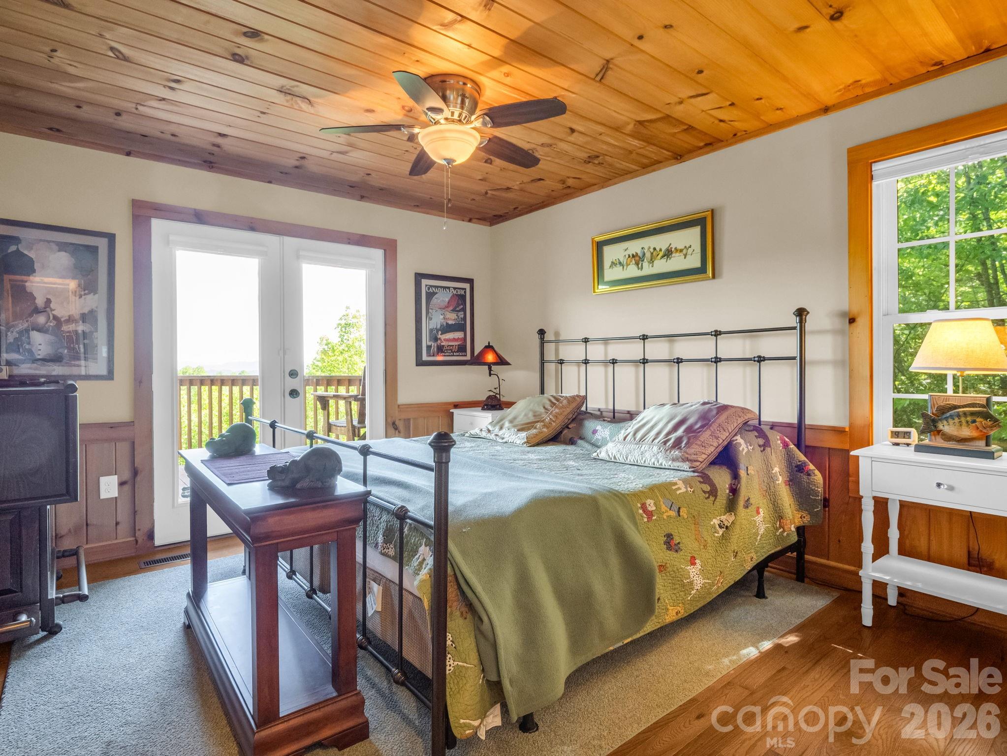 603 Pace Mountain Road Saluda, NC 28773 - Photo 20 of 44 a bed room with a bed and a window