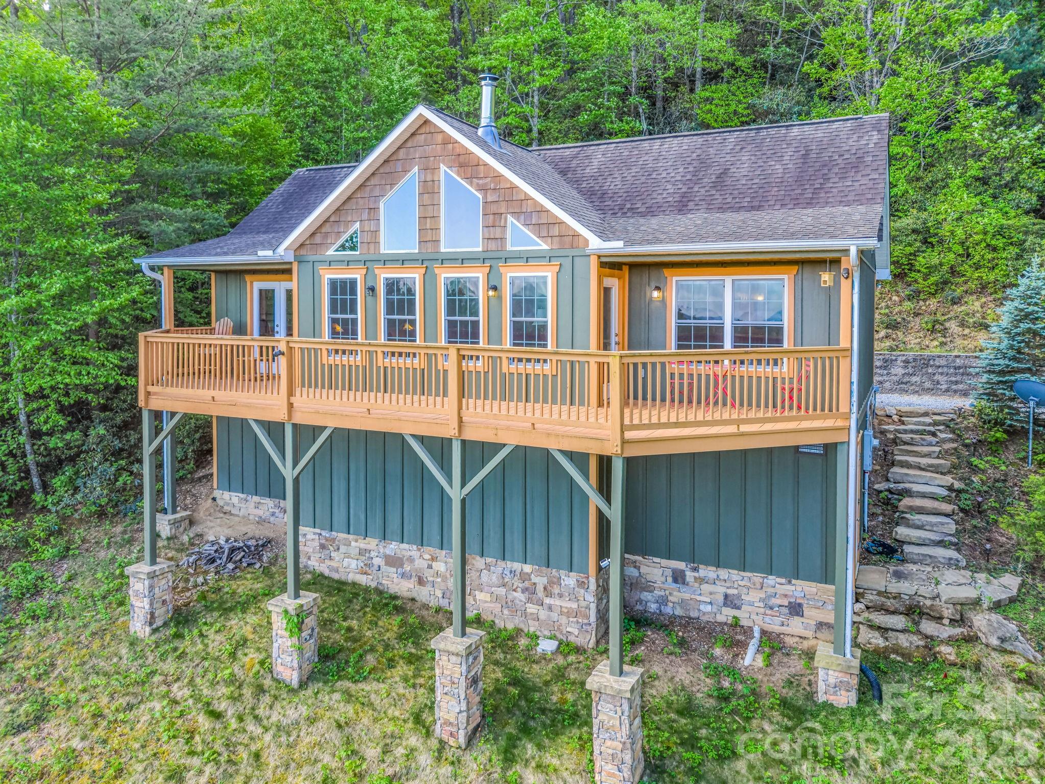 603 Pace Mountain Road Saluda, NC 28773 - Photo 2 of 44 a front view of a house with a yard