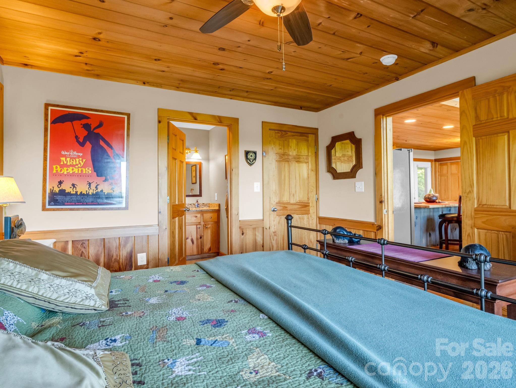 603 Pace Mountain Road Saluda, NC 28773 - Photo 22 of 44 a bedroom with bed and wooden floor