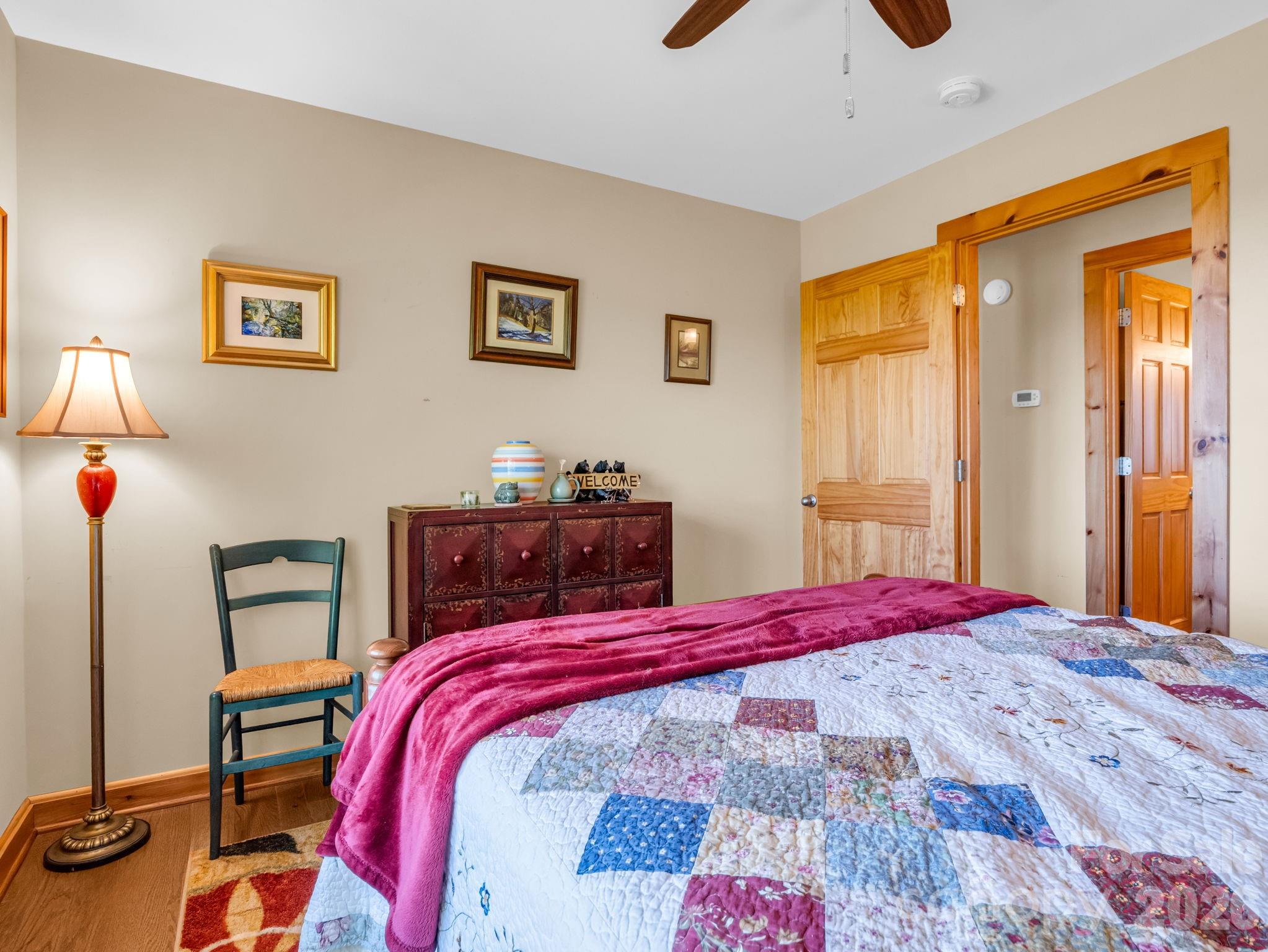 603 Pace Mountain Road Saluda, NC 28773 - Photo 28 of 44 a bed sitting in a bedroom next to a window