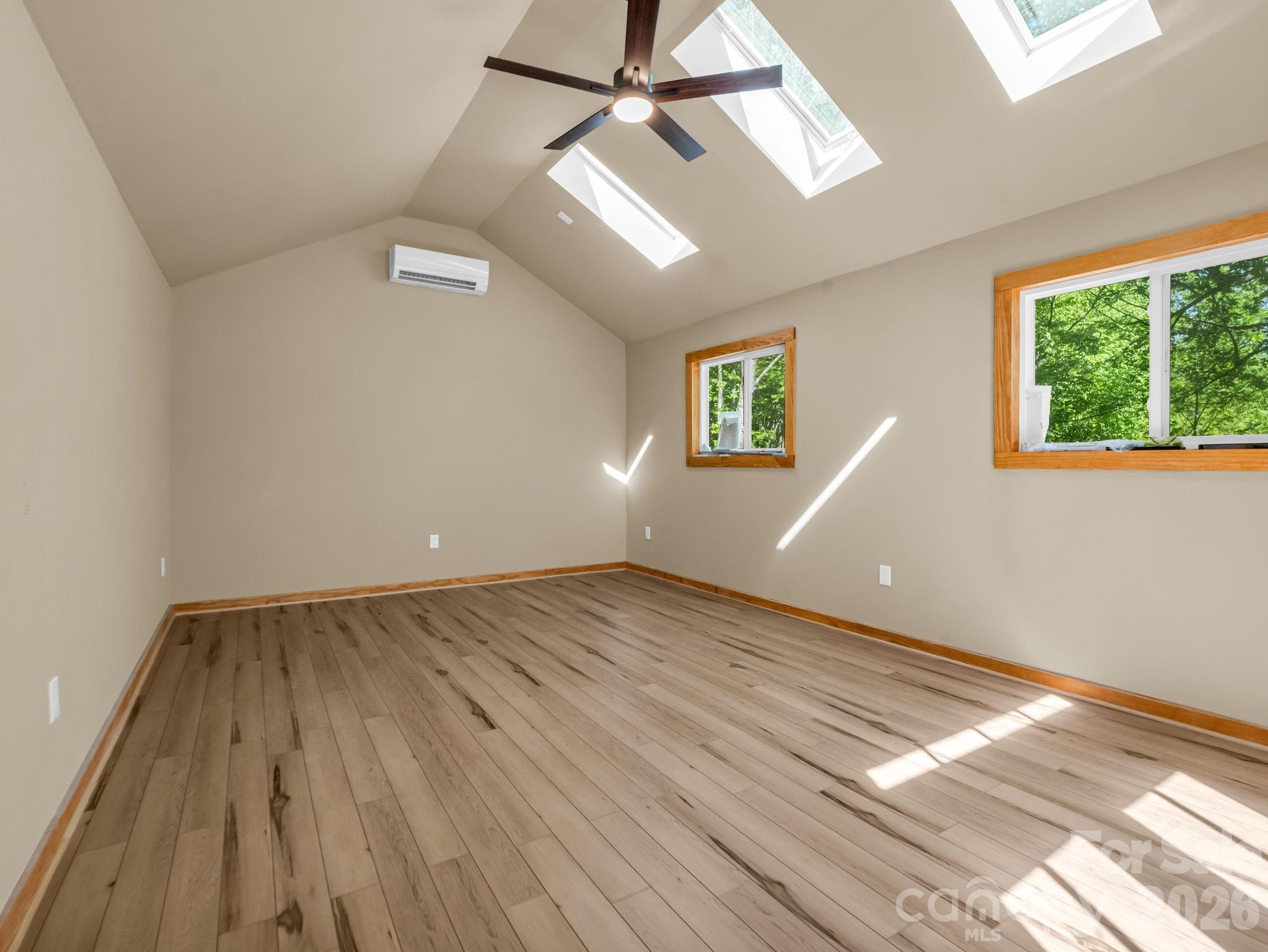 603 Pace Mountain Road Saluda, NC 28773 - Photo 32 of 44 wooden floor in an empty room with a window