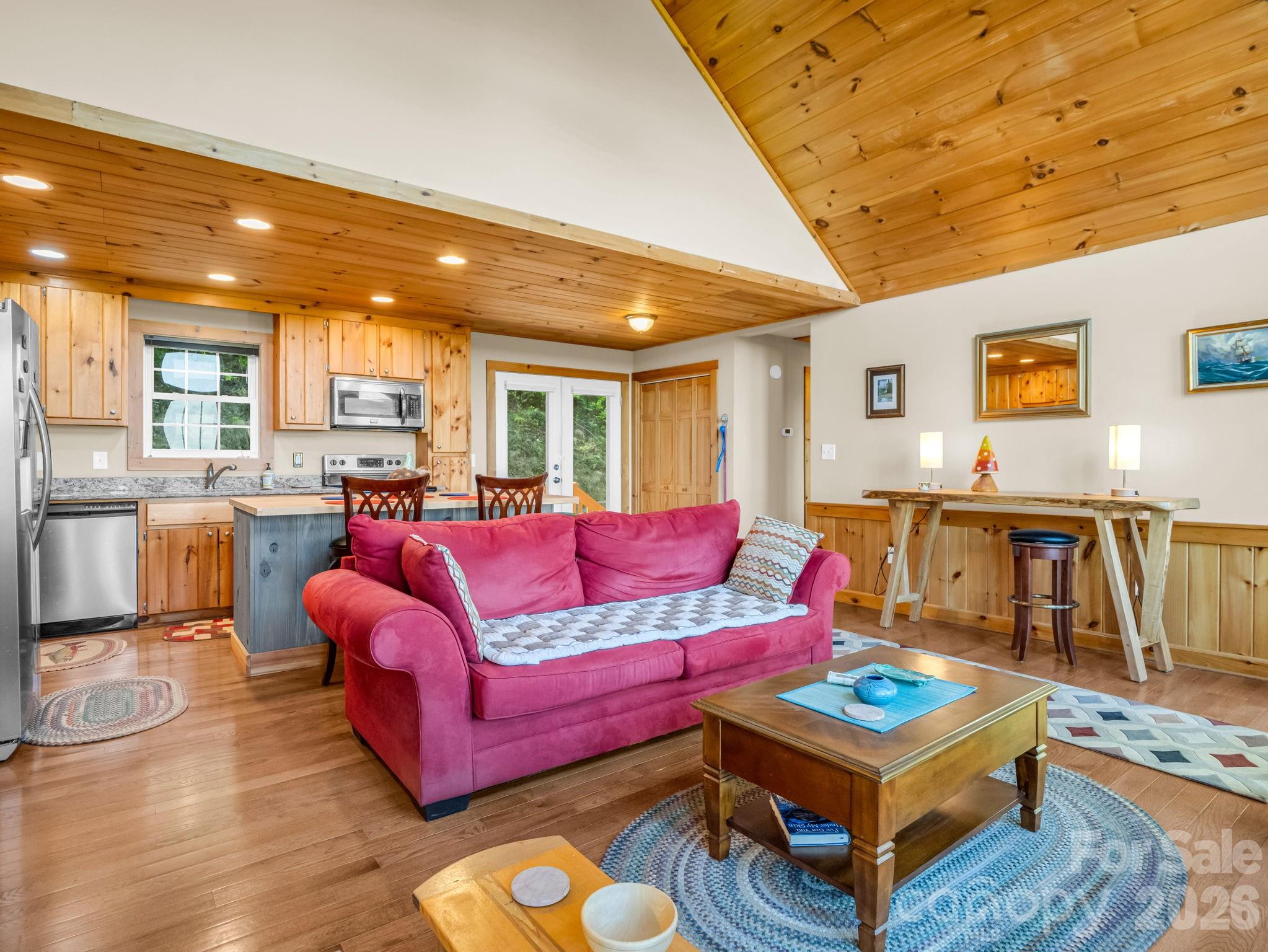 603 Pace Mountain Road Saluda, NC 28773 - Photo 10 of 44 a living room with furniture a flat screen tv and a table