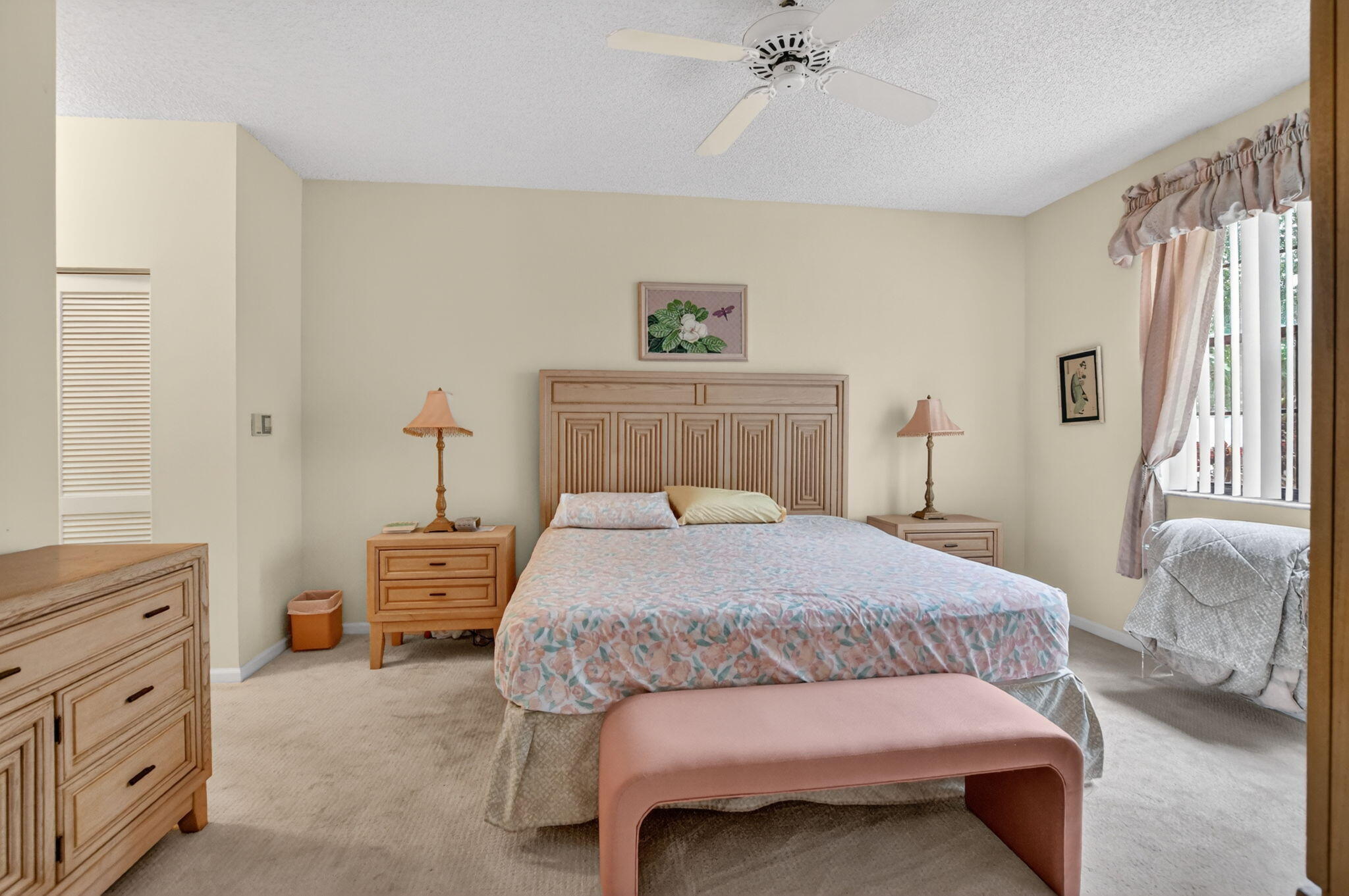 6683 Montego Bay Boulevard, Unit C Boca Raton, FL 33433 - Photo 20 of 37 a bedroom with a bed and a chandelier