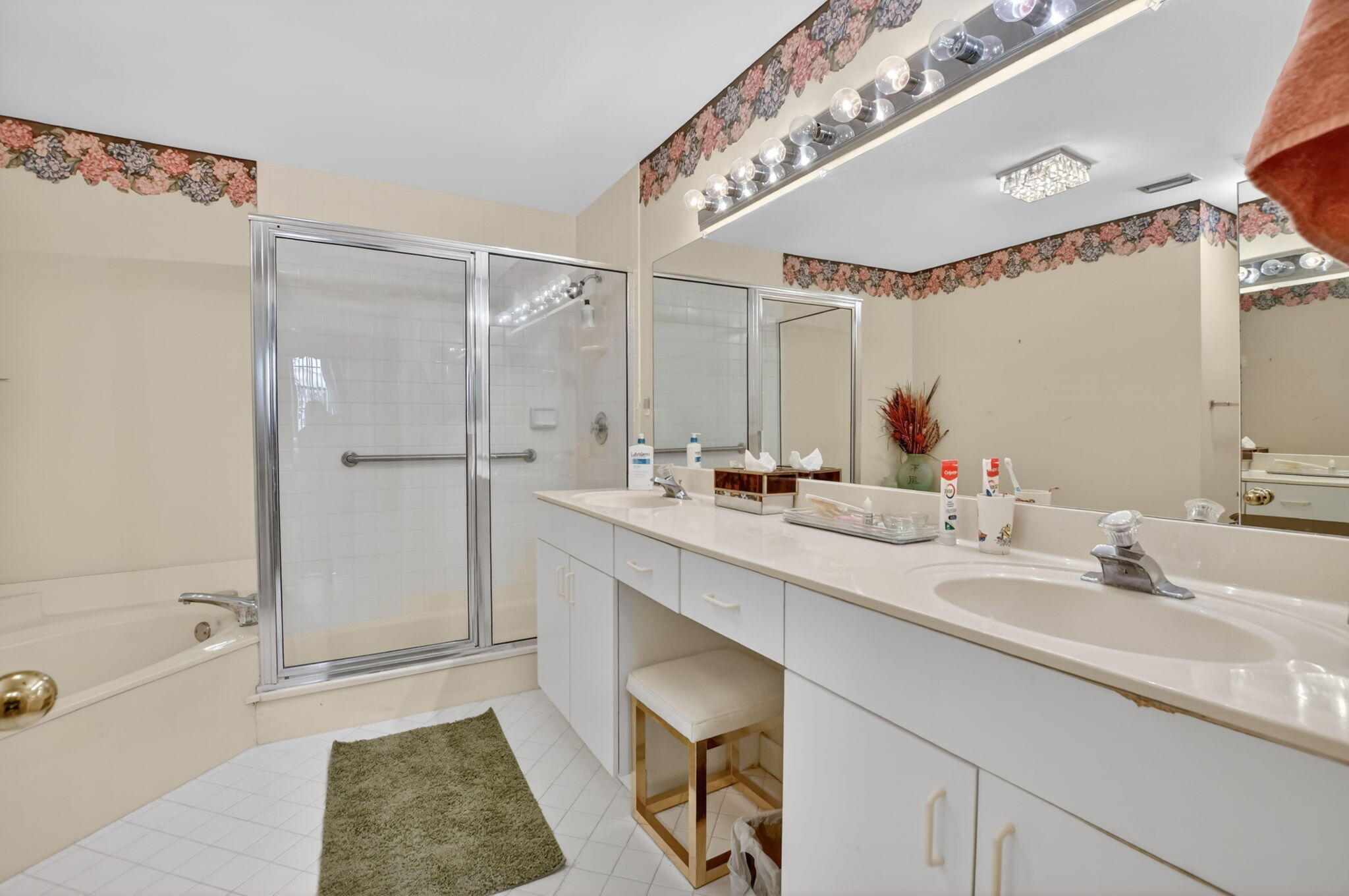 6683 Montego Bay Boulevard, Unit C Boca Raton, FL 33433 - Photo 23 of 37 a bathroom with a tub sink and mirror
