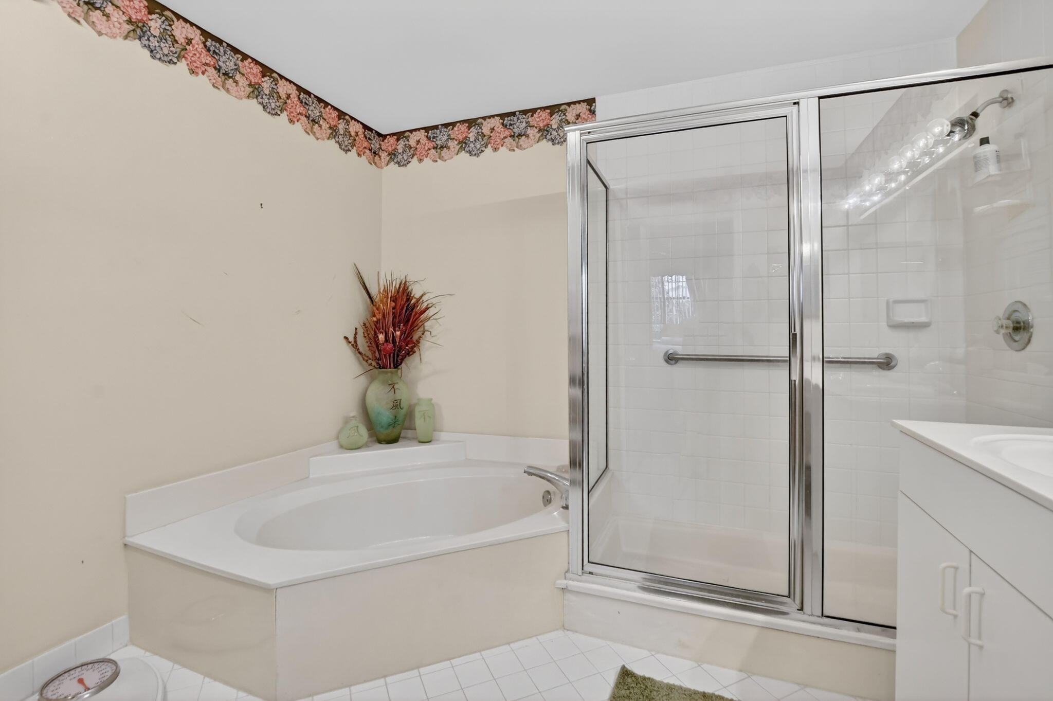 6683 Montego Bay Boulevard, Unit C Boca Raton, FL 33433 - Photo 24 of 37 a bathroom with a bathtub and a shower