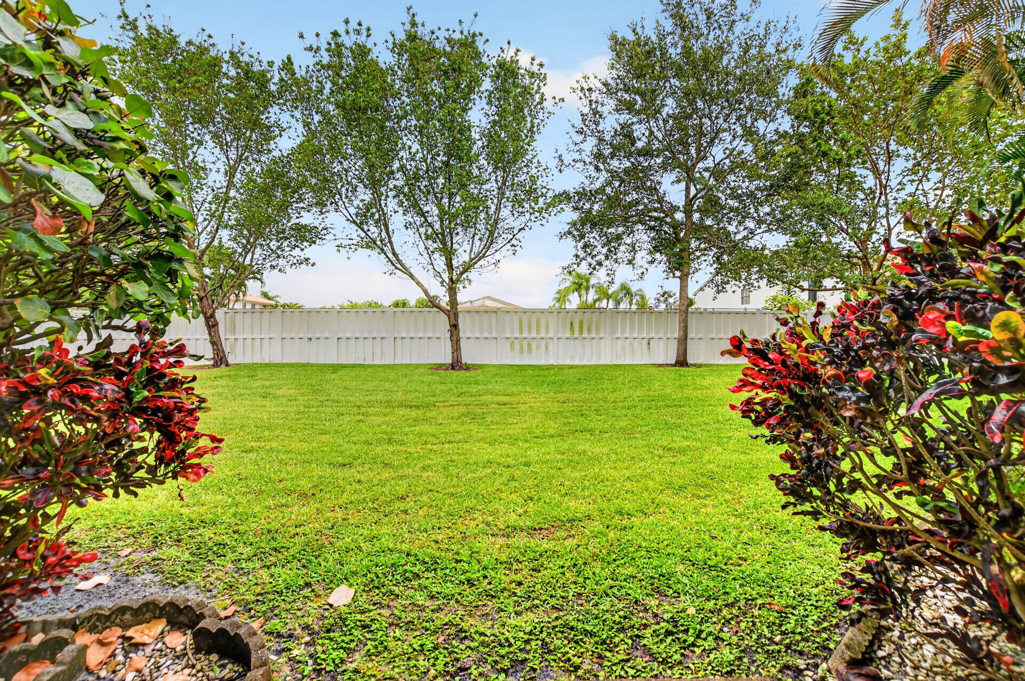 6683 Montego Bay Boulevard, Unit C Boca Raton, FL 33433 - Photo 3 of 37 a view of yard with swimming pool and green space