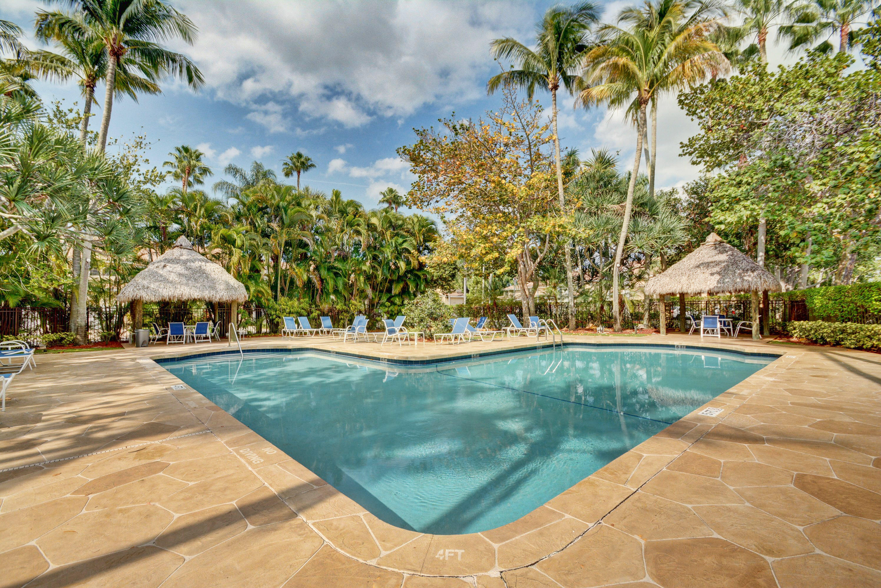 6683 Montego Bay Boulevard, Unit C Boca Raton, FL 33433 - Photo 35 of 37 a view of a swimming pool with a yard