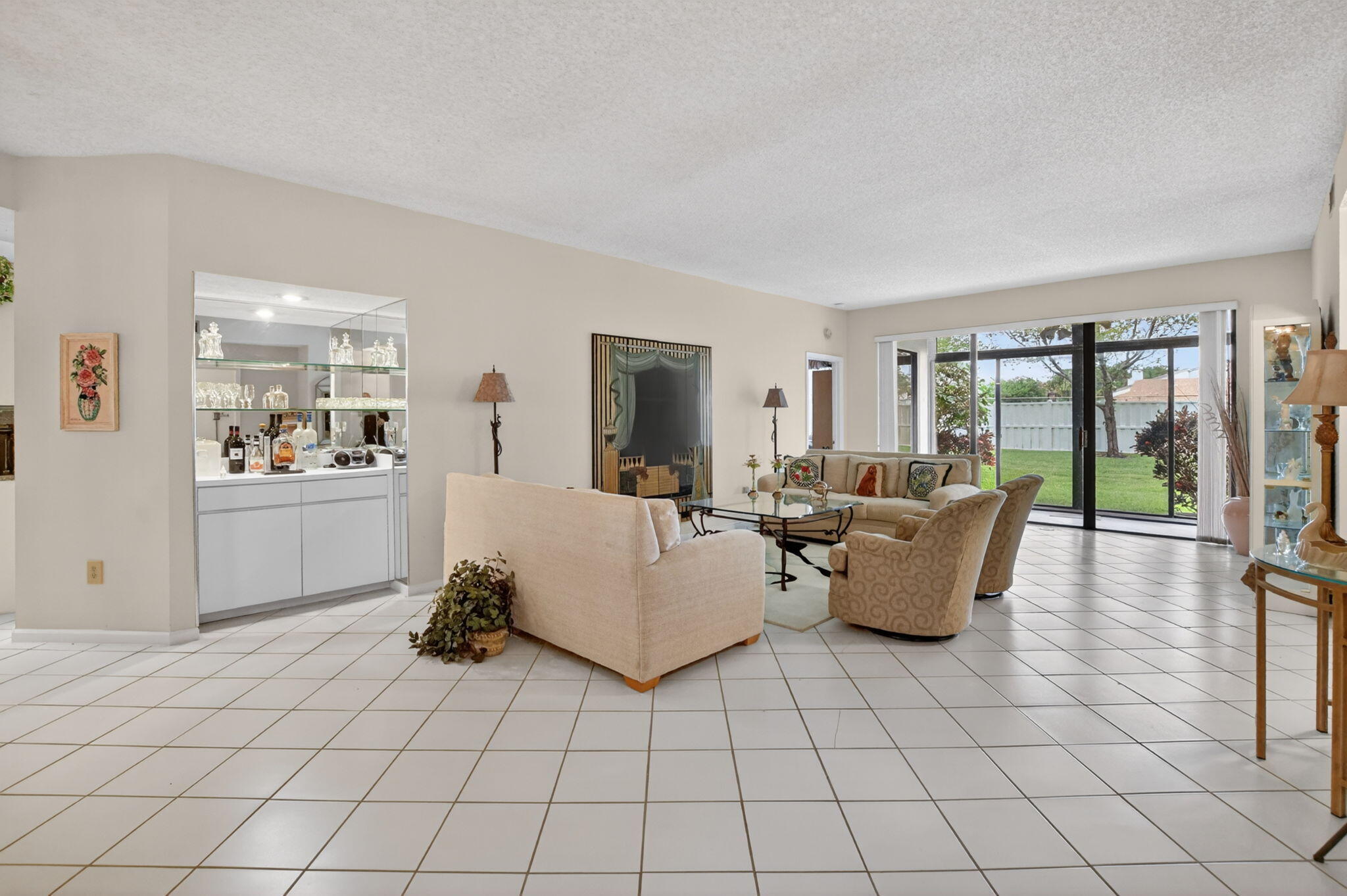 6683 Montego Bay Boulevard, Unit C Boca Raton, FL 33433 - Photo 6 of 37 a living room with furniture and a large window