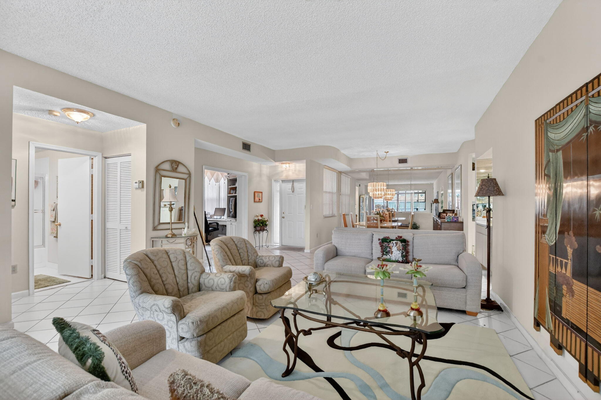 6683 Montego Bay Boulevard, Unit C Boca Raton, FL 33433 - Photo 10 of 37 a living room with furniture and a view of kitchen