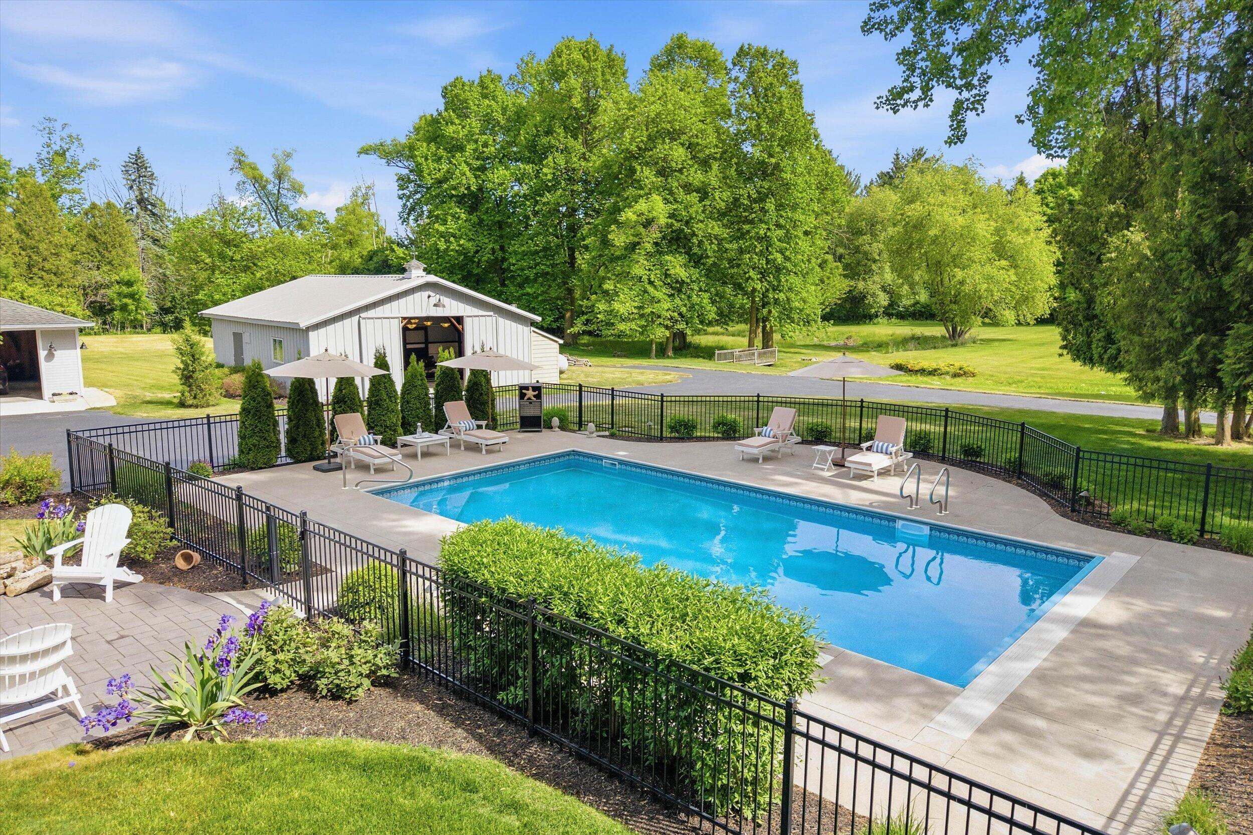 9431 Hawthorne Road Mequon, WI 53097 - Photo 47 of 67 Fenced pool area