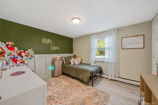 a view of a hallway with windows and stairs