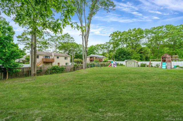 a table and chairs in front of a house