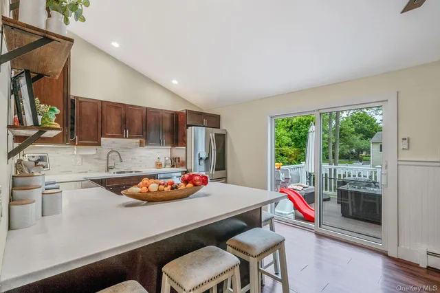 a kitchen with a sink a stove and a refrigerator